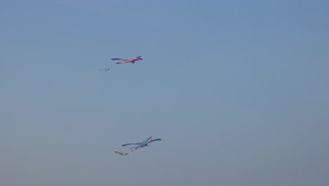 kite soars and dips in evening sky.