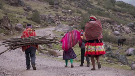 peruvian family carrying sticks in sack.mp4