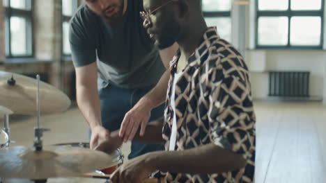 african american man taking drum class