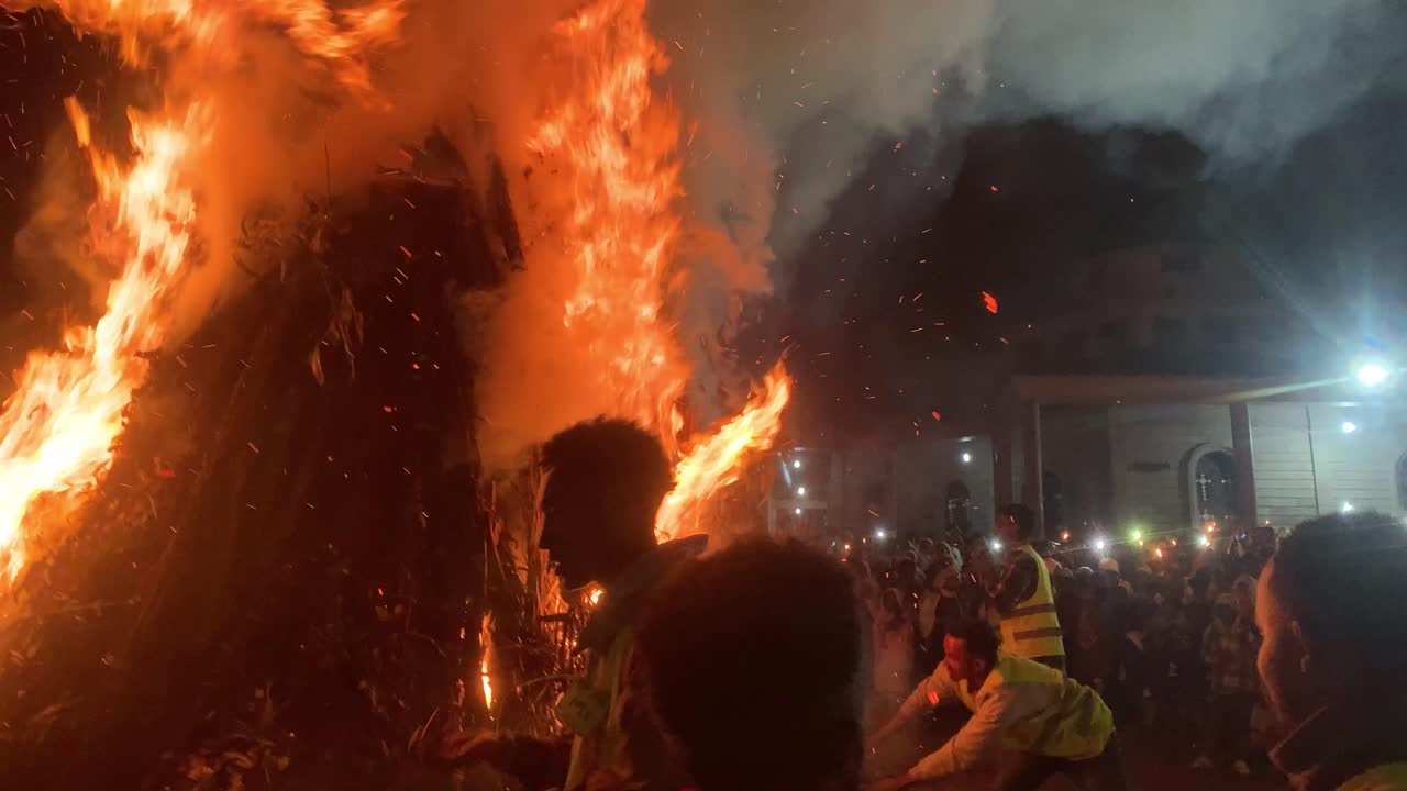 Large Bonfire at Nighttime Religious Ceremony