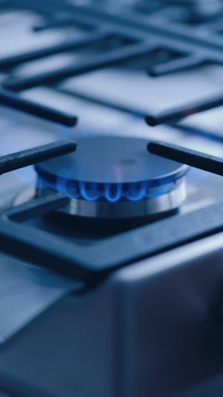 Kitchen gas stove. Modern kitchen stove cook with blue flames burning