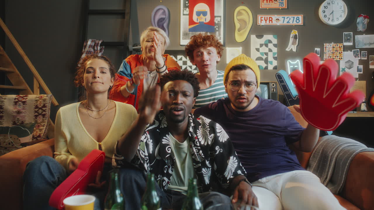 Friends Watching Sports on TV and Reacting to Game Loss with Disappointment