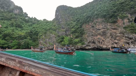 boats navigate scenic cliffs and turquoise waters