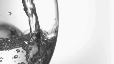 water in super slow motion filling a glass