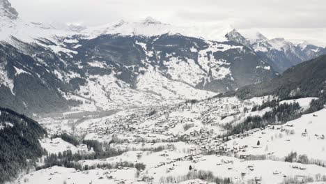 Drone-Aerial-view-of-the-snowy-Grindelwald-and-the-Eiger-in-the-beautiful-swiss-mountain-landscape