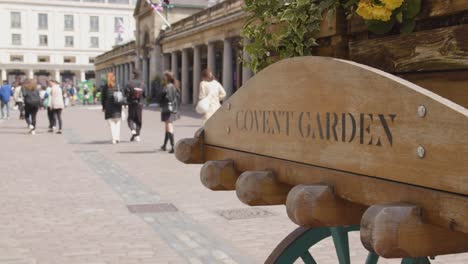 old fashioned market barrow with sign for covent garden london uk 2