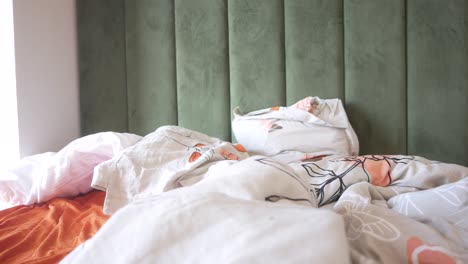 messy unmade bed in a bedroom
