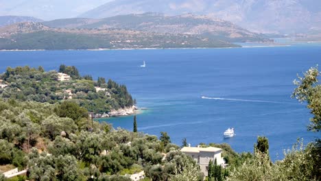 view of yachts sailing on the blue waters of the ionian sea near corfu island