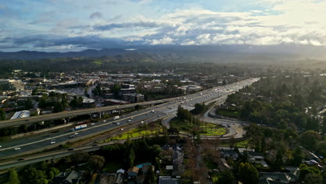 cars driving through the highway along the city