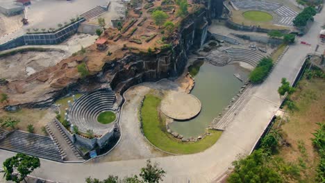 outdoor amphitheater and pond by breksi cliff in yogyakarta, indonesia