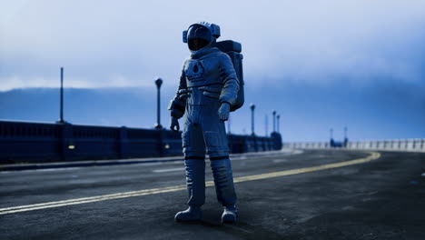 astronaut walking on empty urban road under cloudy sky near a bridge