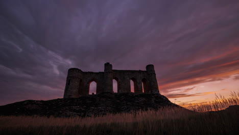 silhouette of ruins at sunset