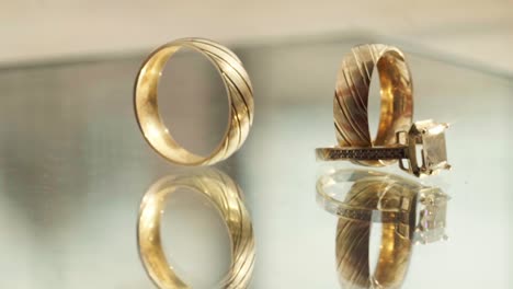 detailed close-up of 14k yellow gold wedding bands featuring a double-line design