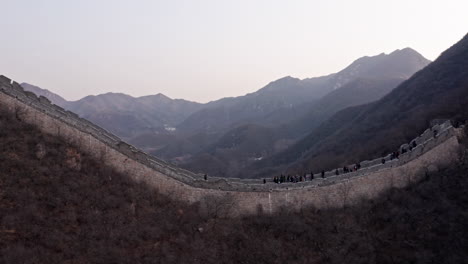 aerial shot of the great wall of china in mountains near beijing