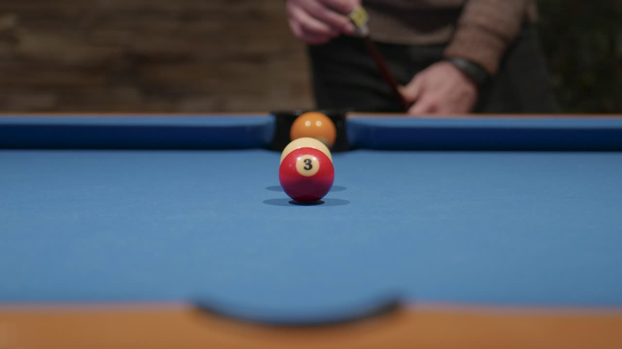 Snooker balls - snooker player chalking the snooker stick
