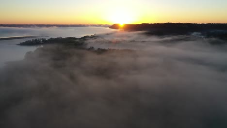 sunrise fog over river valley