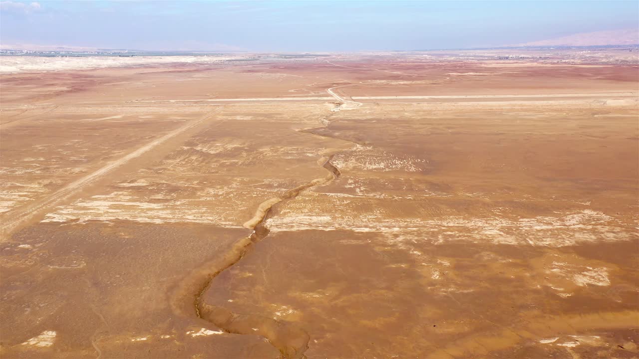 Aerial View of a Large Crack in Arid Desert Landscape