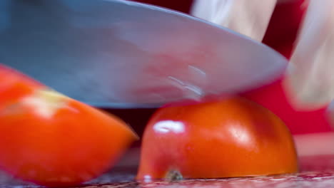 beautiful macro shot of a chef chopping cherry tomatos on their cutting board