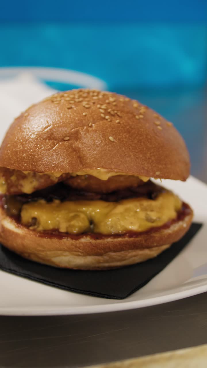 Chef Putting The Wooden Stick Inside The Burger Ready To Be Served