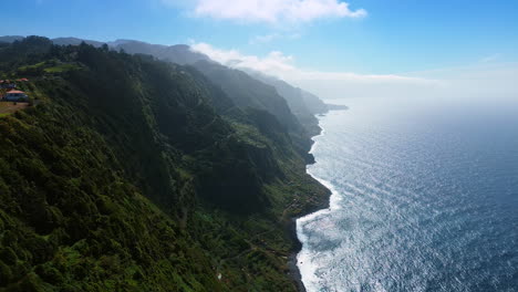 coastline of the madeira islands, portugal at the waterscape of the atlantic ocean. sun dazzling the beautiful scenery. top view.