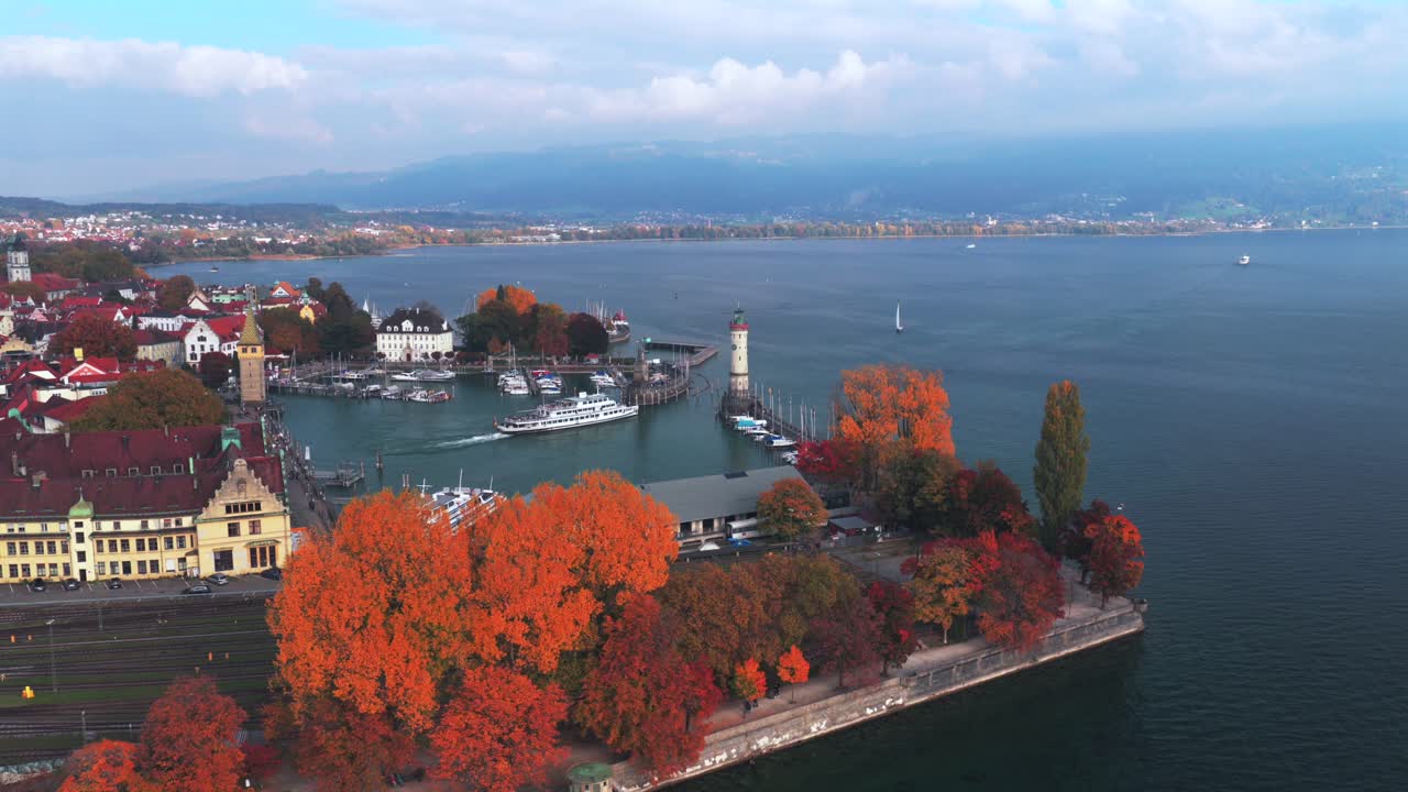 Obersee Bodensee Landau Lake Constance marina harbor view sailboat ferry boat underway Germany Switzerland aerial drone island fall autumn leaves golden hour sunset clouds European upwards motion