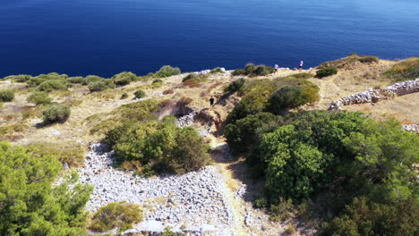 people overlooking the adriatic sea in lastovo island, croatia. - aerial drone