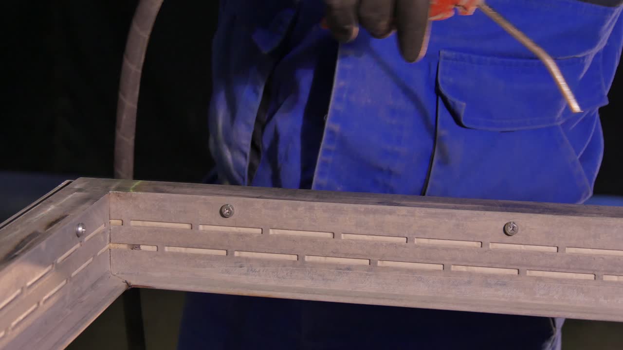 Worker installing metal frame