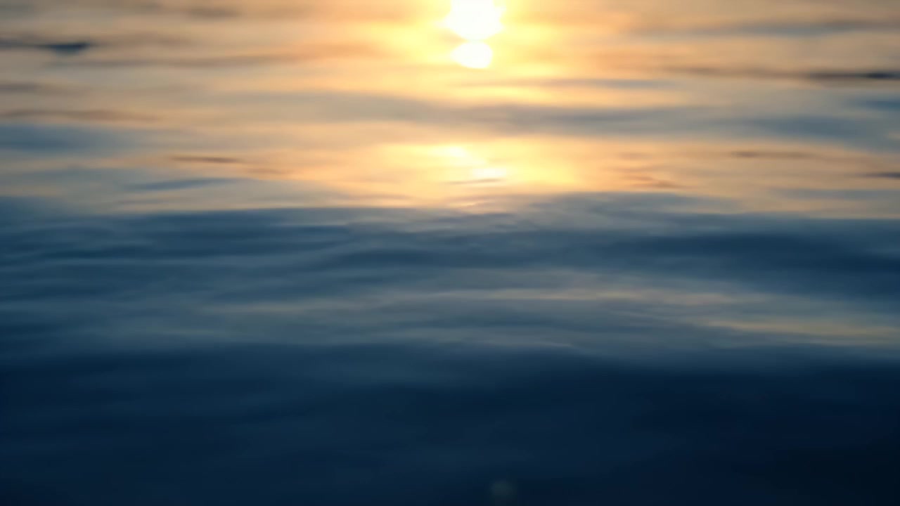 Golden Sunset Reflection on Gentle Ocean Waves