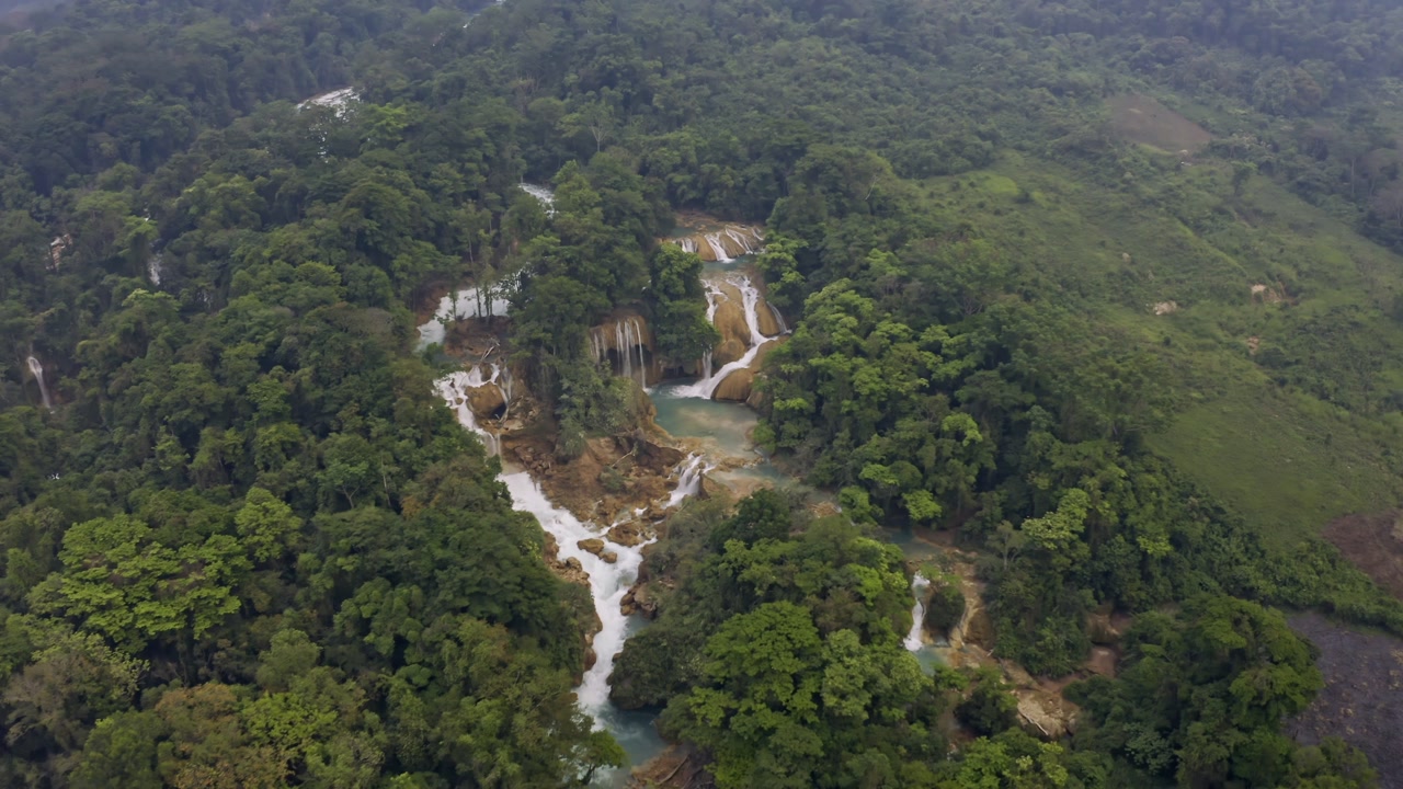 An aerial drone shot captures the mesmerizing Cascadas de Agua Azul in Chiapas, Mexico.