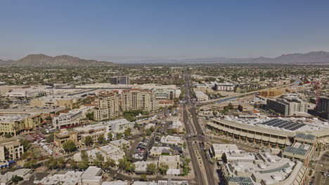 scottsdale arizona aerial v14 drone flyover north road capturing downtown cityscape of corporate offices, waterfront shopping mall and fashion square complex - shot with mavic 3 cine - february 2022