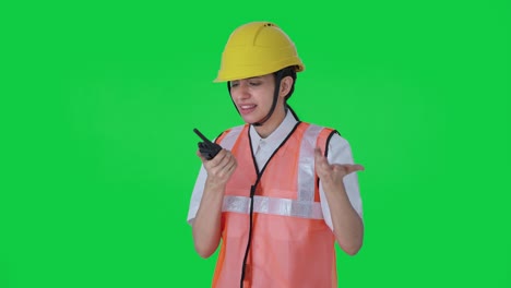 Angry-Indian-female-architect-shouting-on-walkie-talkie-Green-screen