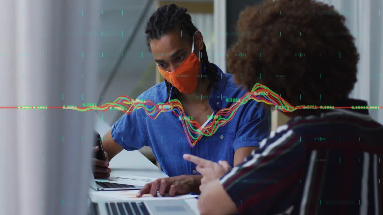 Animation of data processing over diverse business people with face masks using laptops