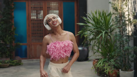 happy person dancing with headphones