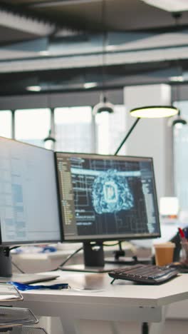 vertical video pc display on startup office desk showing artificial intelligence code