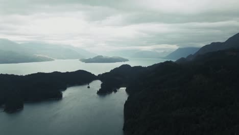 Misty-Landscape-Over-Calm-Ocean-And-Forest-Mountain-Islands-In-British-Columbia,-Canada