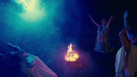 ancient ritual ceremony by women around a night fire