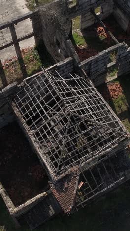 aerial view of ruins of an abandoned stone building