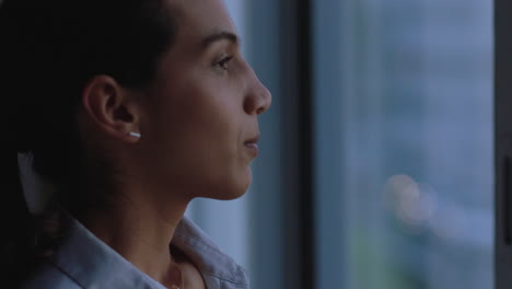 young-business-woman-getting-ready-in-hotel-room-looking-out-window-preparing-for-new-day-successful-independent-female-planning-ahead-at-sunrise