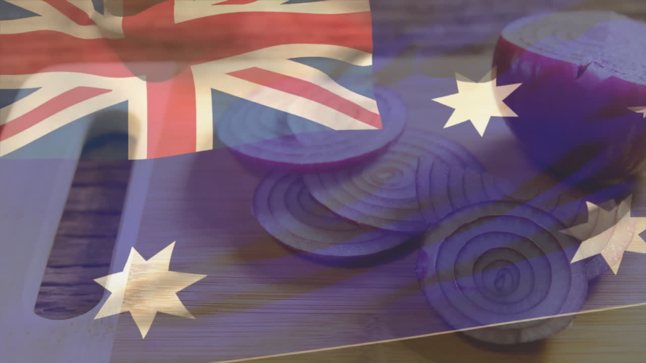 Australian flag animation overlaying sliced red onions on wooden cutting board