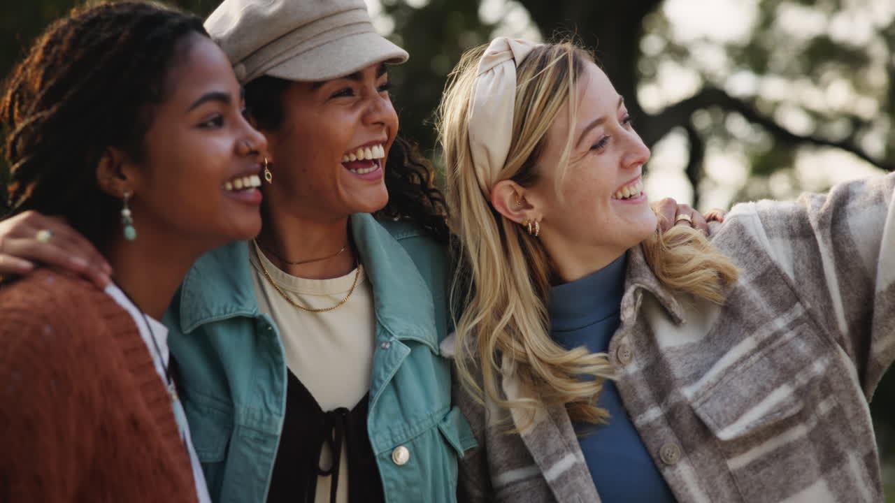 Three happy young women friends enjoying time outdoors