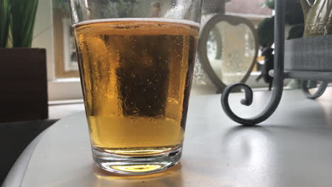 glas of beer in slowmotion