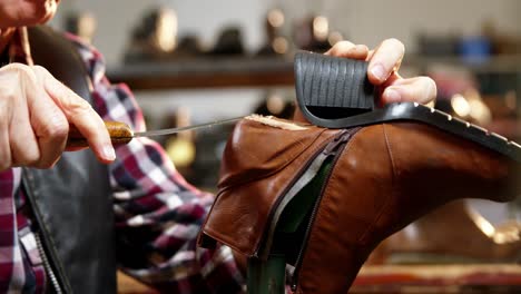 Shoemaker-repairing-a-shoe