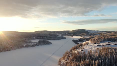 Beautiful-winter-sunset-in-Norway-with-mountains-and-a-frozen-lake-in-the-background