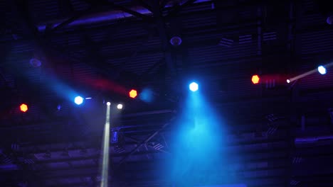 flashing multicolored spotlight of scene lights in the dark