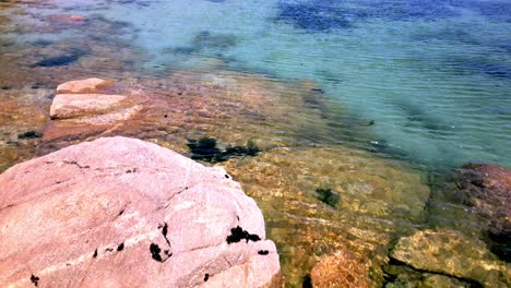 Close-Up-Footage-of-Rocky-Seabed-in-Clear-Ocean-Turquoise-Water-in-Spain