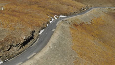 road on col de l'iseran mountain pass, france