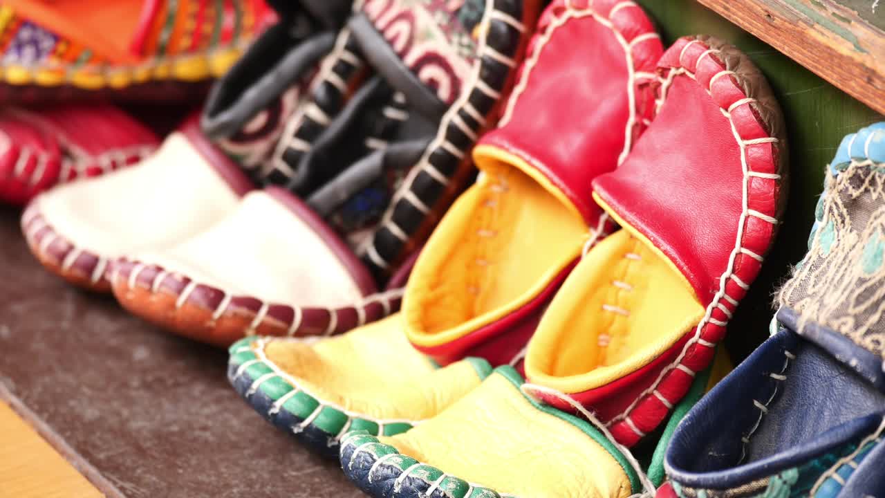 Colorful Handmade Leather Slippers on Display at a Market