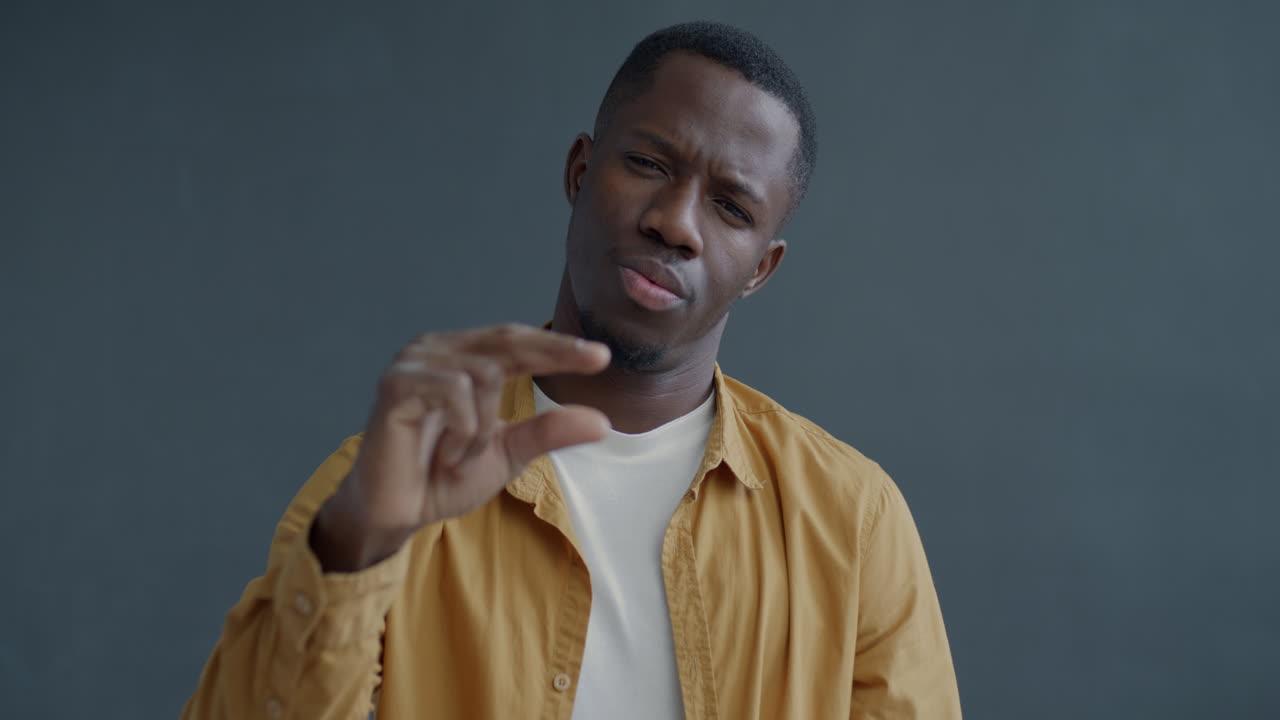 Man Showing a Small Size