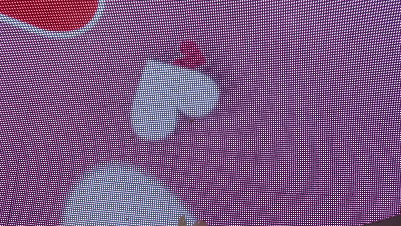 Boy jumping on interactive floor display with hearts