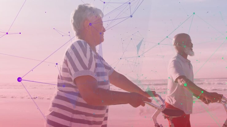 Animation of shapes over happy senior african american couple with bicycles at beach